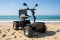 Load image into Gallery viewer, Front view of the Discover Your Mobility Cheeta Ninja All Terrain Bariatric Scooter showing its sturdy frame and large wheels.