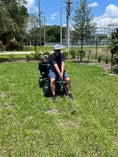 Load image into Gallery viewer, Discover Your Mobility Cheeta Ninja all-terrain bariatric scooter seen from the rear view, showcasing its rugged design and large wheels.