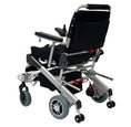 Load image into Gallery viewer, EZ Lite Cruiser Deluxe Regular DX8 electric wheelchair shown unfolded from the back-left angle, highlighting the frame and wheels.
