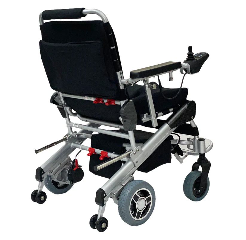 EZ Lite Cruiser Deluxe Regular DX8 electric wheelchair viewed from the back unfolded, showing its sturdy frame and rear wheels.