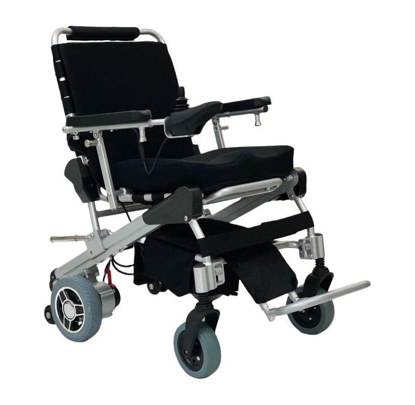 EZ Lite Cruiser Deluxe Regular DX8 electric wheelchair viewed from front right angle, unfolded and ready for use.