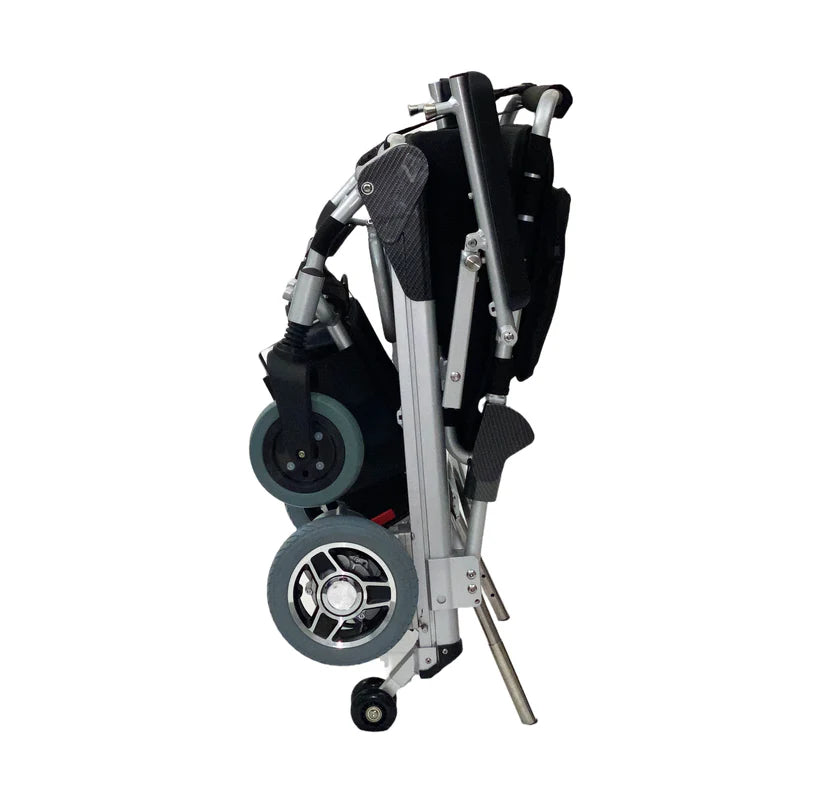 EZ Lite Cruiser Deluxe Regular DX8 electric wheelchair folded, side view showing compact design and frame details.